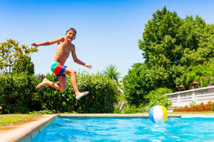 kid jumping in pool, pool heater repair